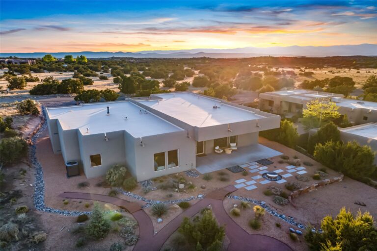 Aerial photo of sun setting over modern house in Santa Fe, NM